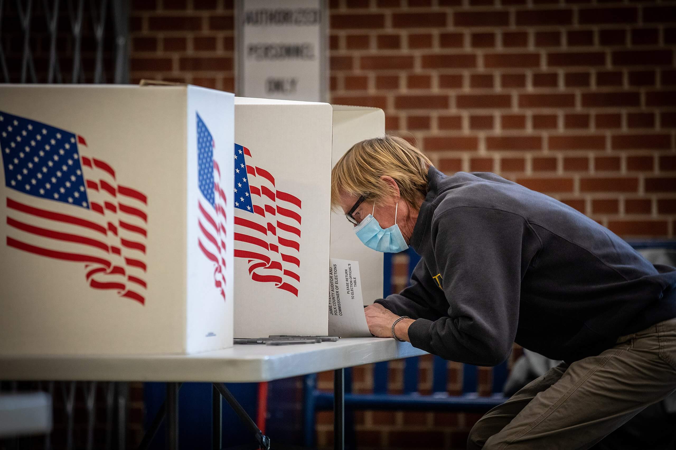 A voter in Iowa casts a ballot.